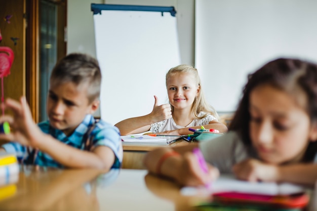 Free Photo children sitting in classroom studying