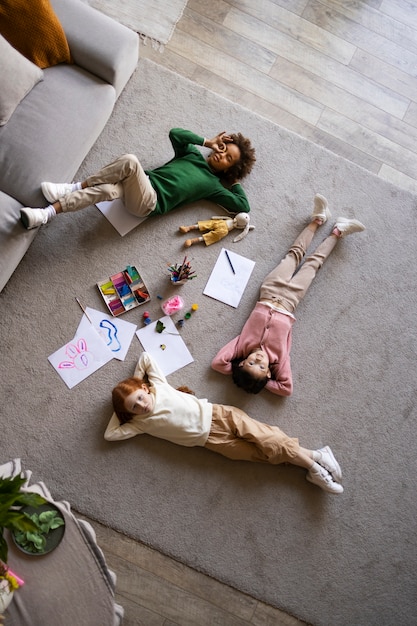 Free Photo children spending time together in the comfort of their home