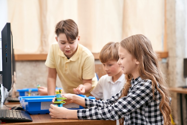 Free photo children using building kit