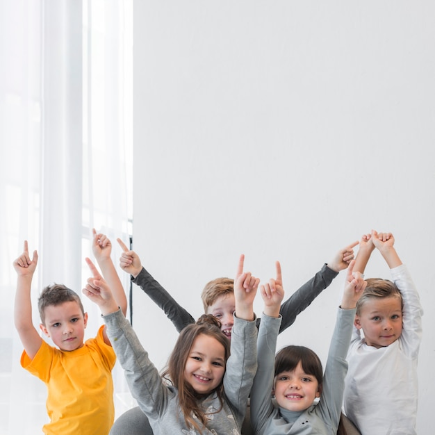 Free photo children with their hands up