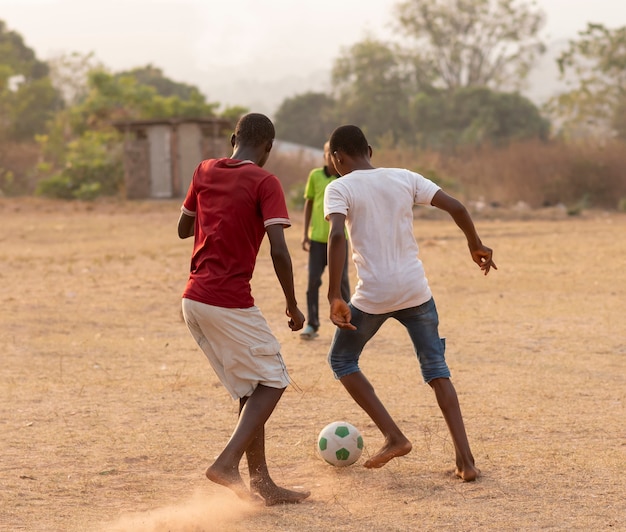 Childrens playing football