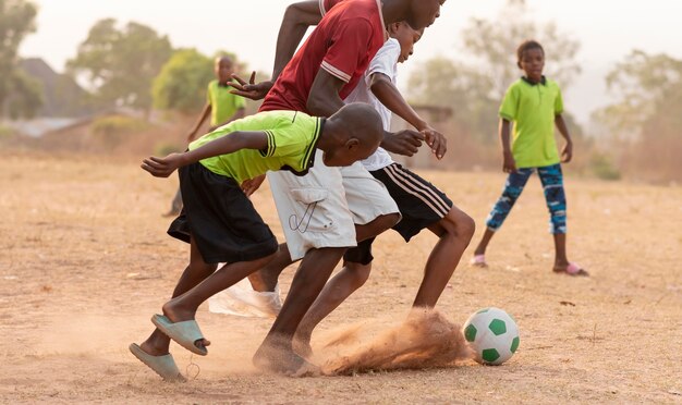 Childrens playing football