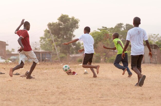 Childrens playing football