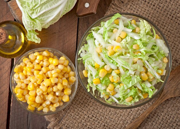 Chinese cabbage salad with sweet corn in a glass bowl