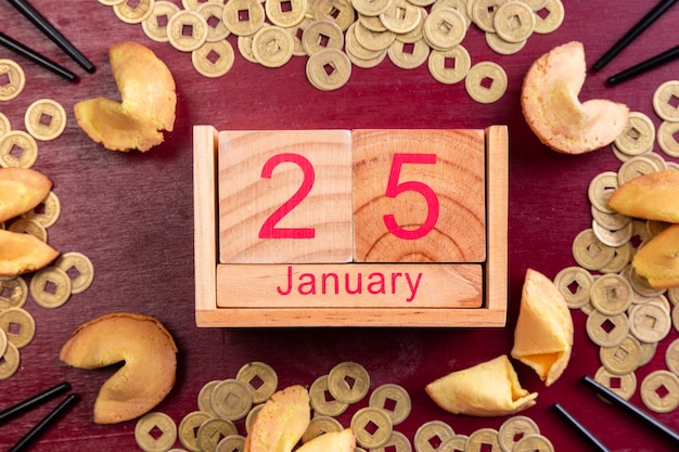 Free photo chinese new year date with coins and fortune cookies