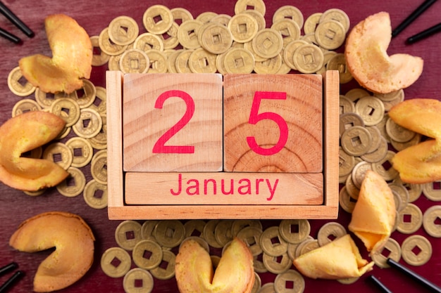 Free photo chinese new year date with fortune cookies and coins