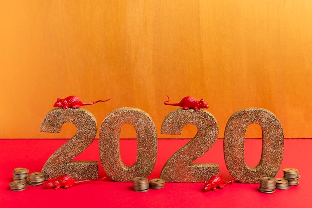 Free photo chinese new year golden number with rat figurines and coins