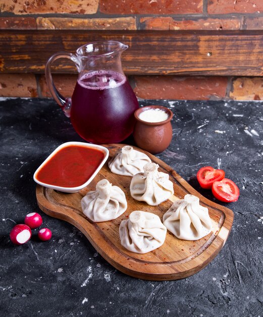 Free Photo chinese steamed buns with red sauce