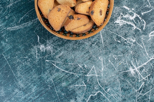 Chocolate butter cookies on blue surface.