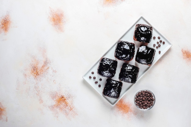 Chocolate cake bites with chocolate sauce and with fruits,berries.