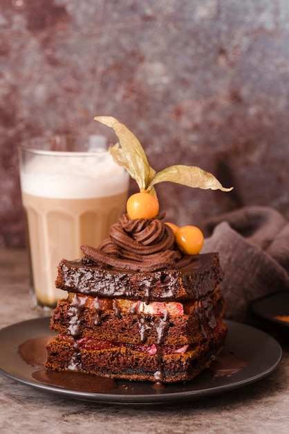 Chocolate cake on plate with chocolate milk