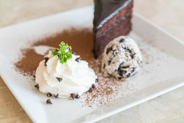 chocolate cake with ice-cream and whipped cream