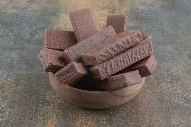 Chocolate coated wafers piled in a small bowl 