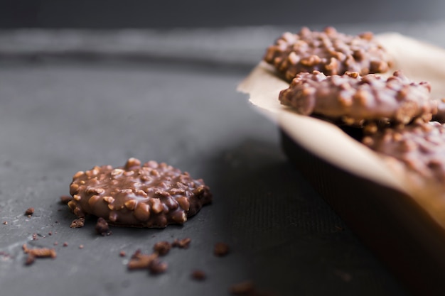 Chocolate cookie on table next to plate