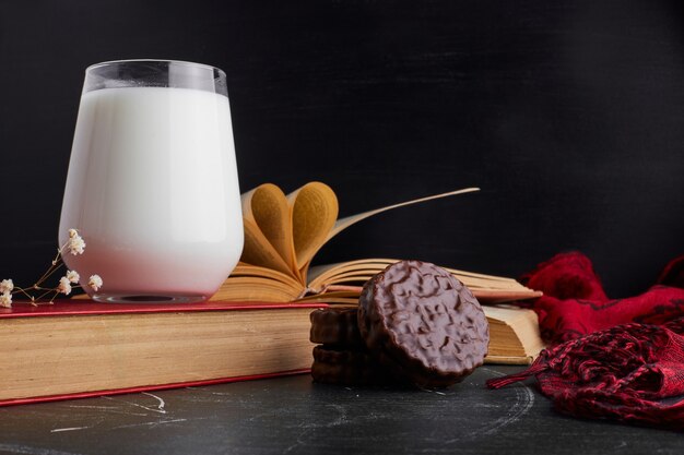 Chocolate cookies with a glass of milk. 