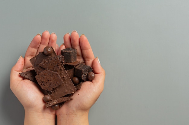 Chocolate on the dark surface. World Chocolate Day concept