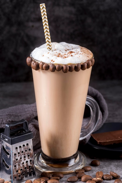 Chocolate dessert with coffee beans and straw