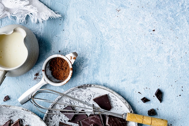 Free photo chocolate ganache truffle ingredients in a kitchen flat lay