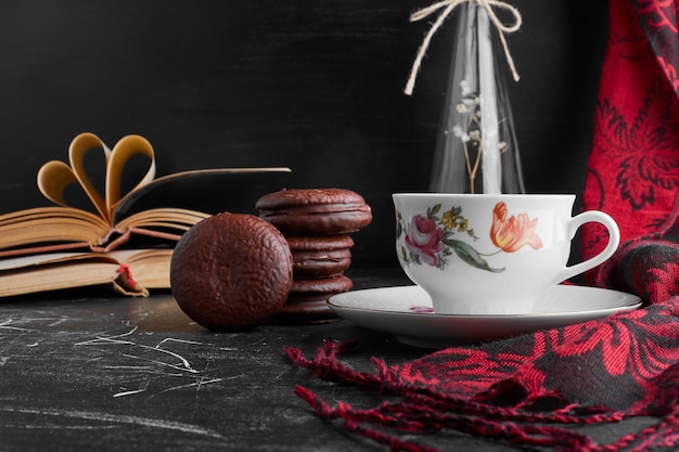 Chocolate marshmallow cookies with a cup of tea. 