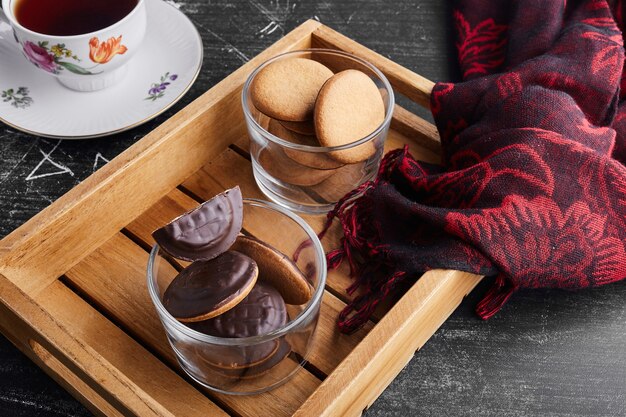 Chocolate sponge cookies in a glass cup . 