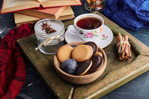 Chocolate sponge cookies with a cup of tea. 