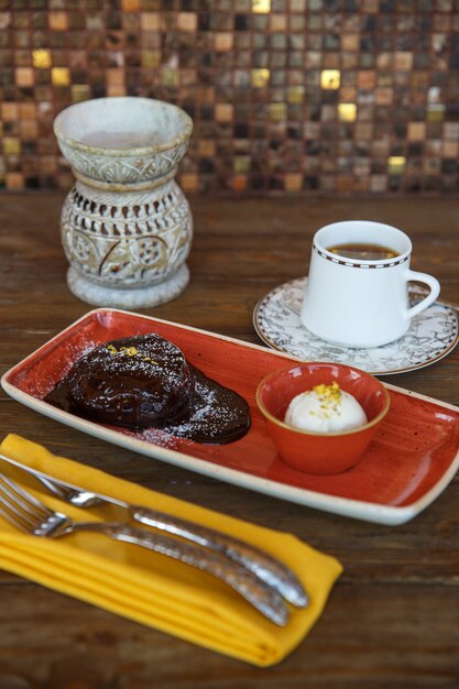 Chocolate volcano served with vanilla ice cream and tea