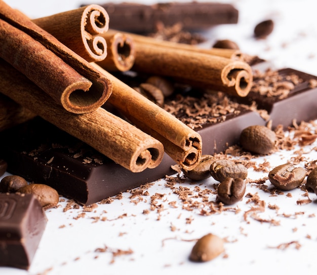 Free photo chocolate with cinnamon and coffee beans