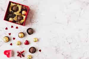 Free photo chocolates in a marble texture background