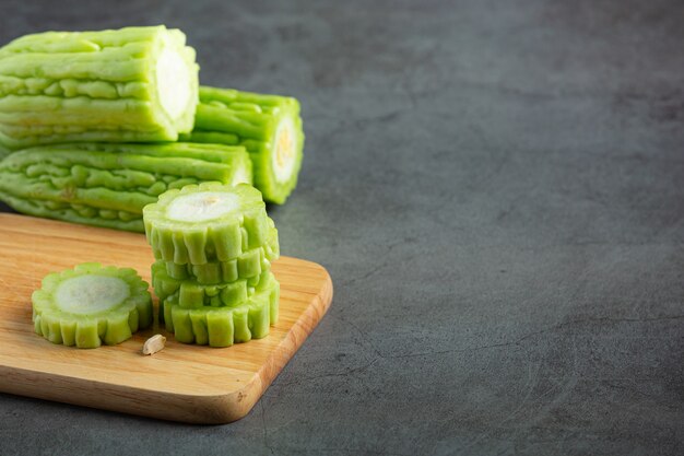 chopped bitter gourd put on wooden cutting board