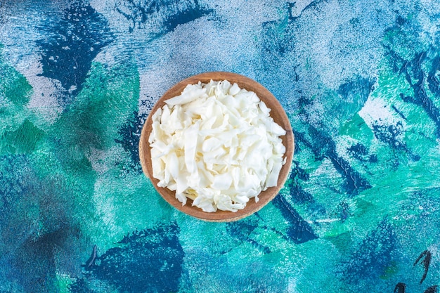 Chopped cabbage in a bowl on a trivet