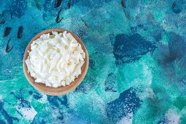 Chopped cabbage in a bowl on a trivet