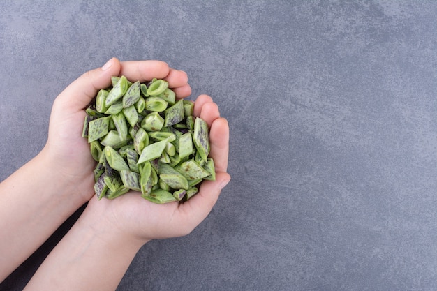 Chopped green beans isolated on blue surface