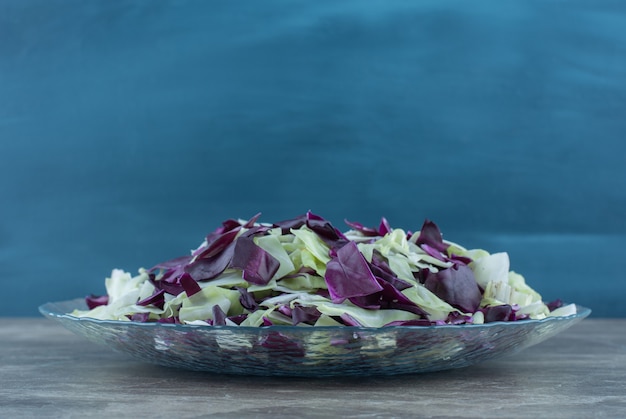 Free Photo chopped vegetable in the glass bowl , on the marble table. 