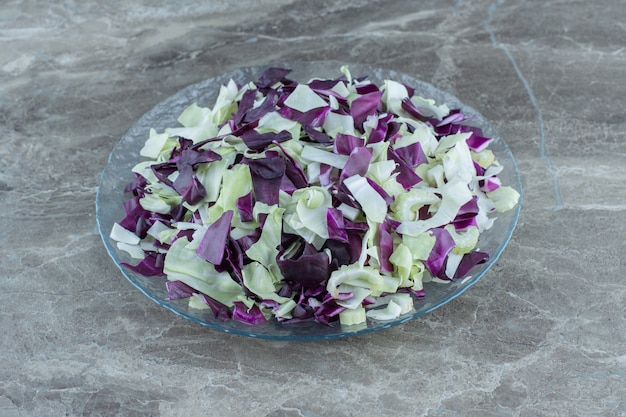 Free Photo chopped vegetable in the glass bowl , on the marble table. 