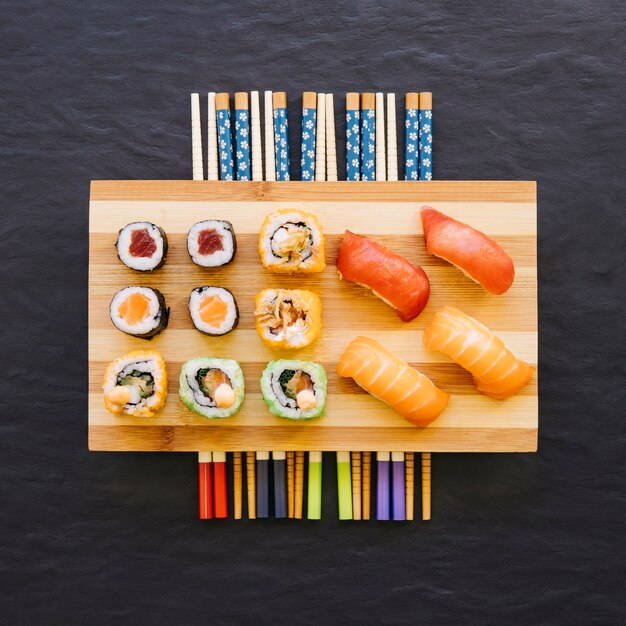 Chopsticks under sushi