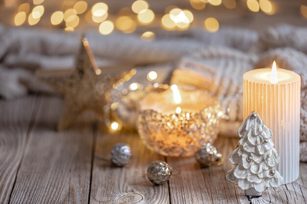 Christmas background with burning candle and decor details