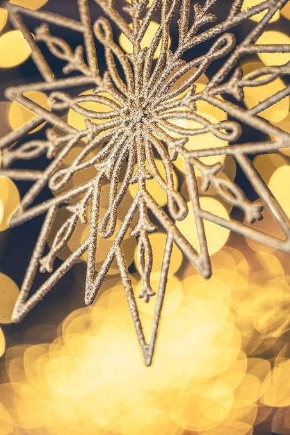 Free Photo christmas background with decorative snowflake with bokeh lights