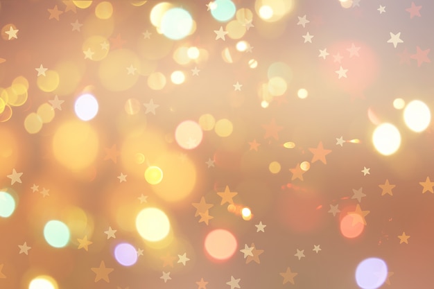 Free photo christmas background with stars and bokeh lights