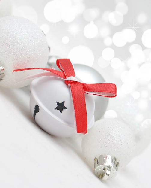 Free photo christmas background with white decorations and bell