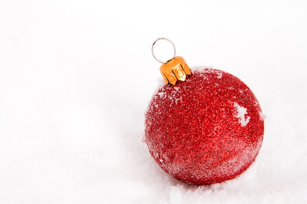 Christmas ball covered with snow