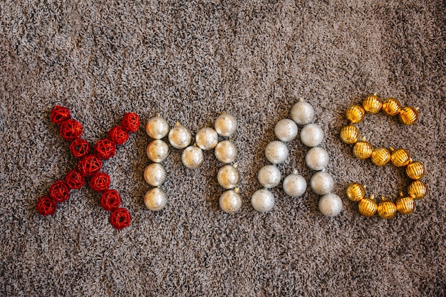 Free photo christmas balls forming word xmas