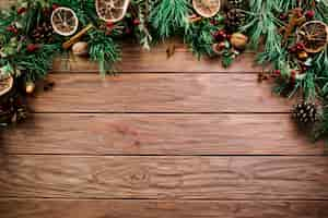 Free photo christmas branch on wooden board