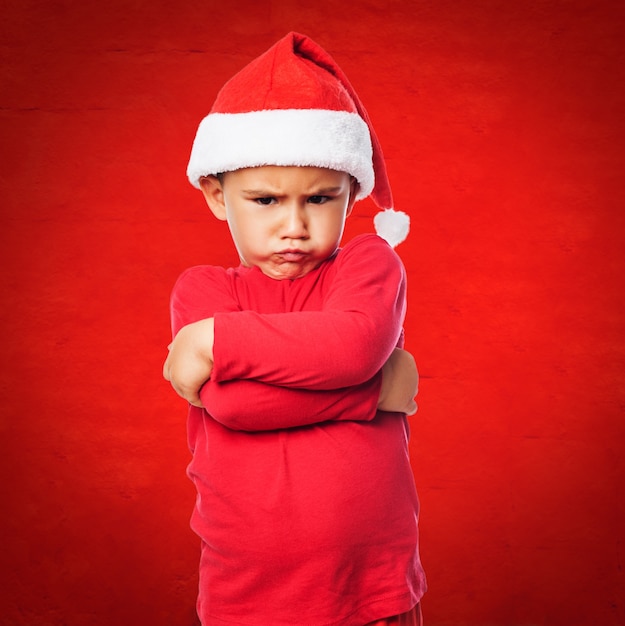 Christmas child with red background