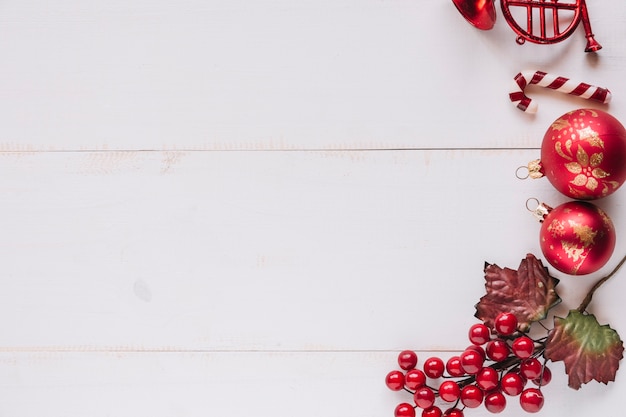 Christmas composition of baubles with red berries 