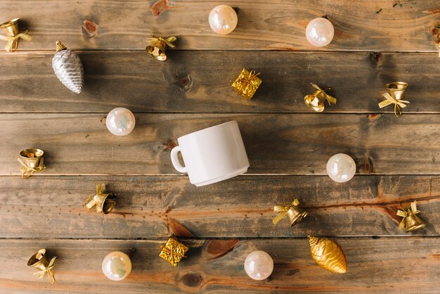 Christmas composition of cup with baubles 