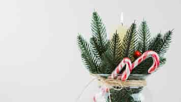 Free photo christmas composition of fir branch and candle