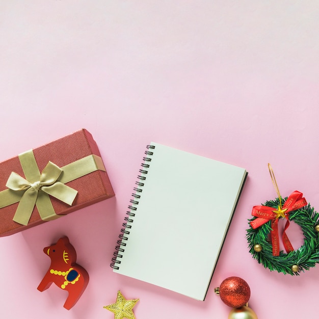 Christmas composition of notepad with gift box