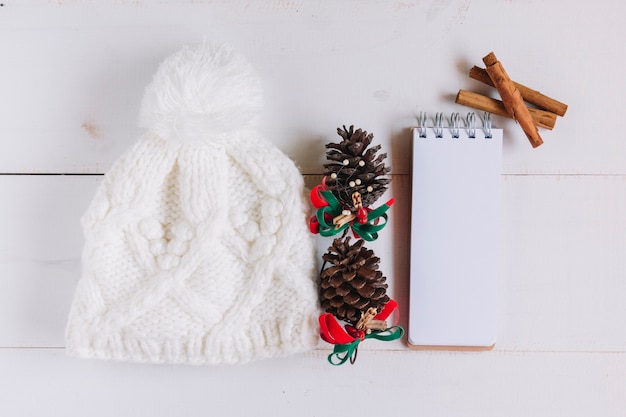 Free photo christmas composition of white hat with cones