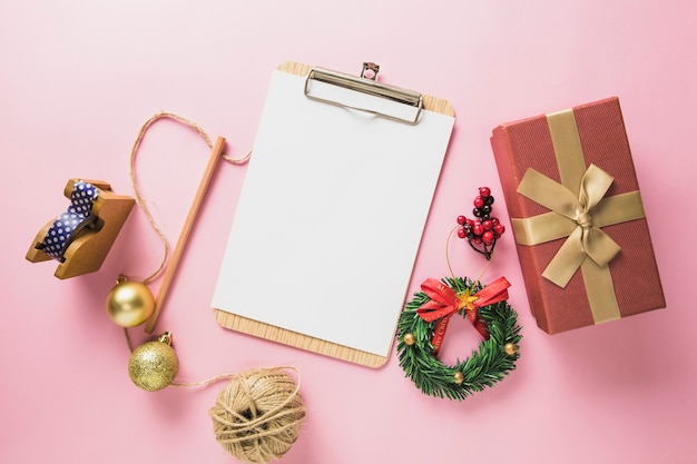 Christmas composition with clipboard and present box