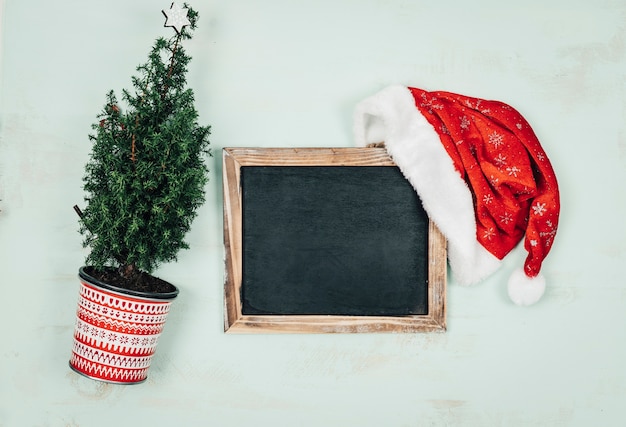 Free photo christmas composition with slate and fir plant